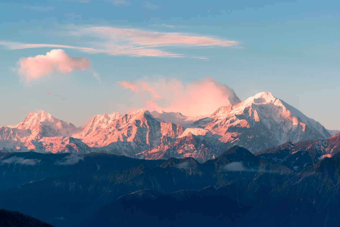 Open road through dramatic mountains, long-distance running setting